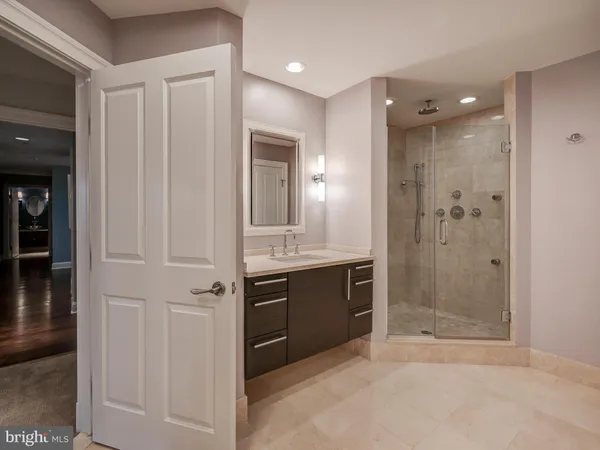 a bathroom with a shower and a sink