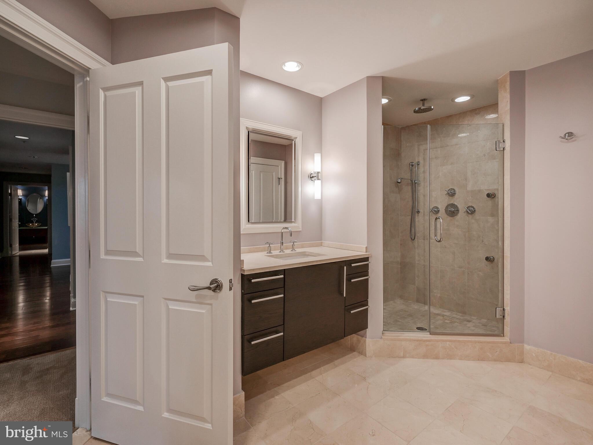 801 Key Highway, Unit 312 Baltimore, MD 21230 - Photo 25 of 45 a bathroom with a shower and a sink