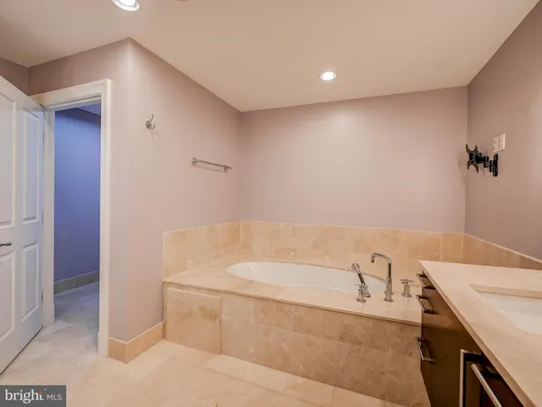 a bathroom with a bathtub and a sink