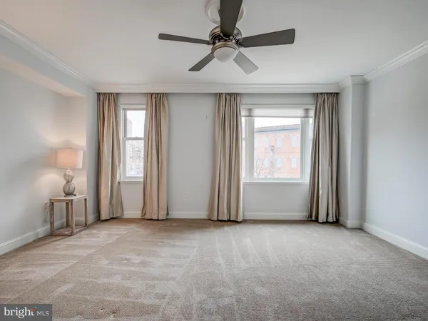 a view of empty room with windows