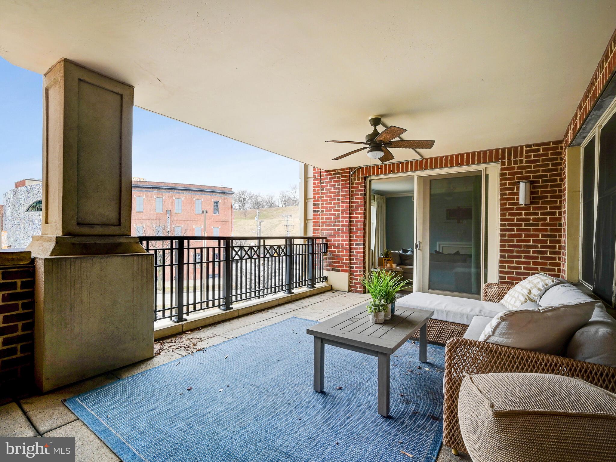 801 Key Highway, Unit 312 Baltimore, MD 21230 - Photo 38 of 45 a living room with furniture and window