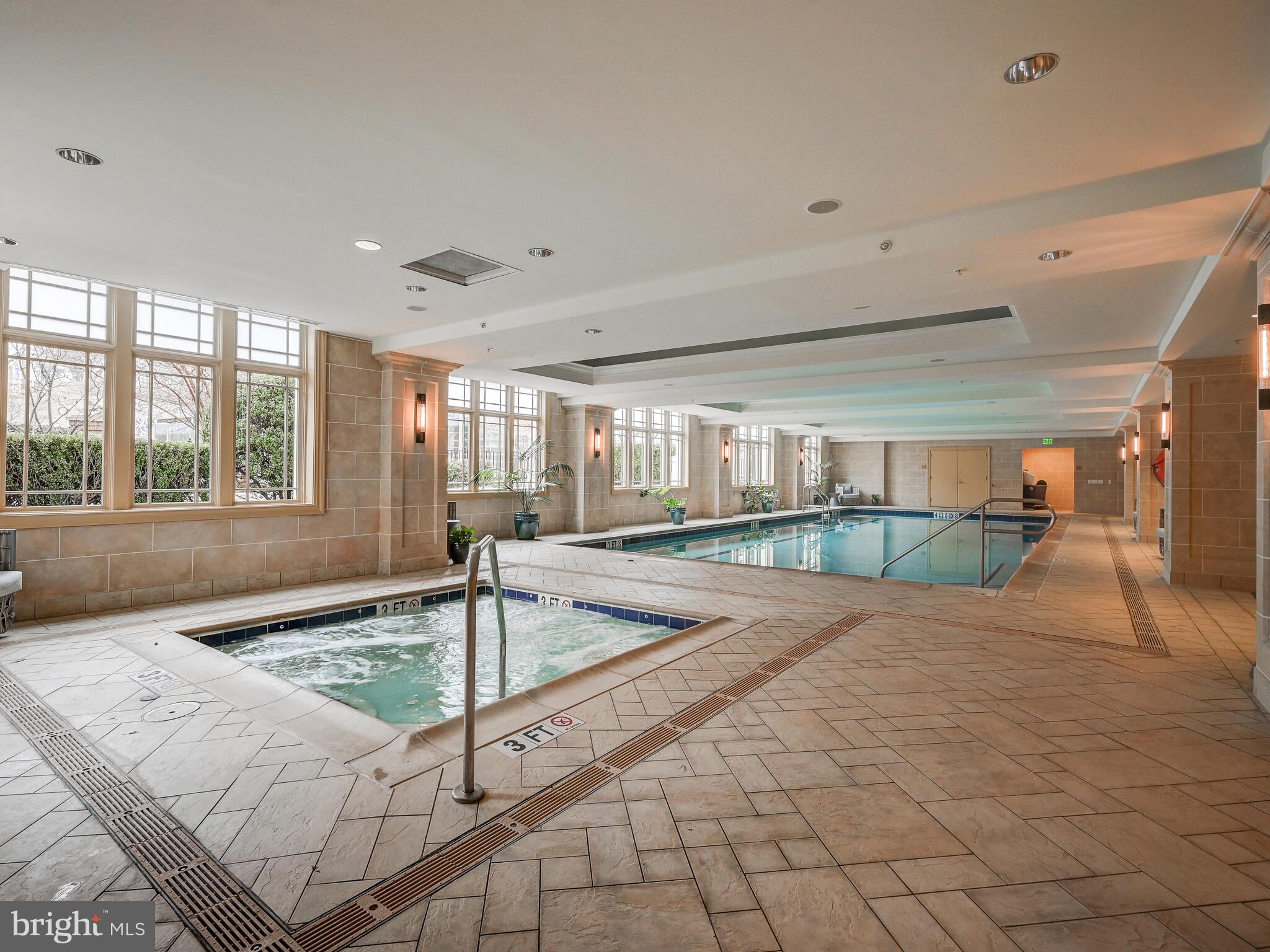 801 Key Highway, Unit 312 Baltimore, MD 21230 - Photo 45 of 45 a swimming pool with a large window and chandelier