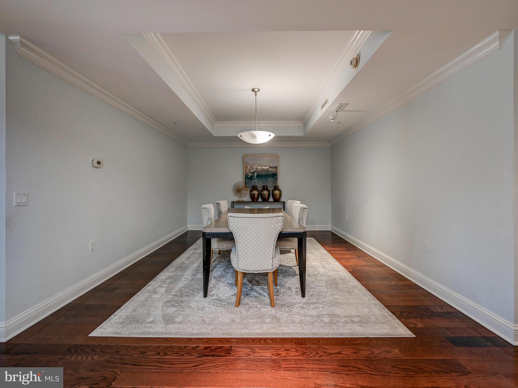801 Key Highway, Unit 312 Baltimore, MD 21230 - Photo 5 of 45 a dining room with furniture and wooden floor