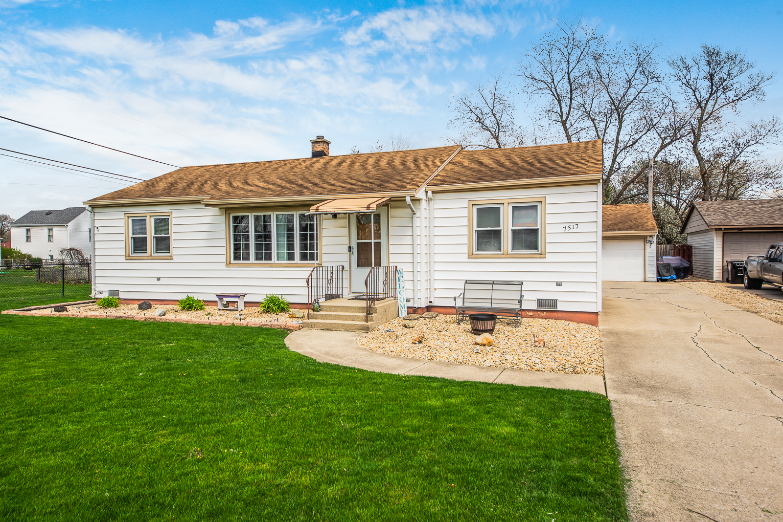 a view of a house with a backyard