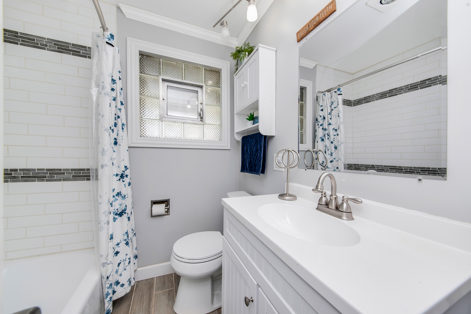 7517 Beloit Avenue Bridgeview, IL 60455 - Photo 11 of 18 a bathroom with a sink toilet and shower