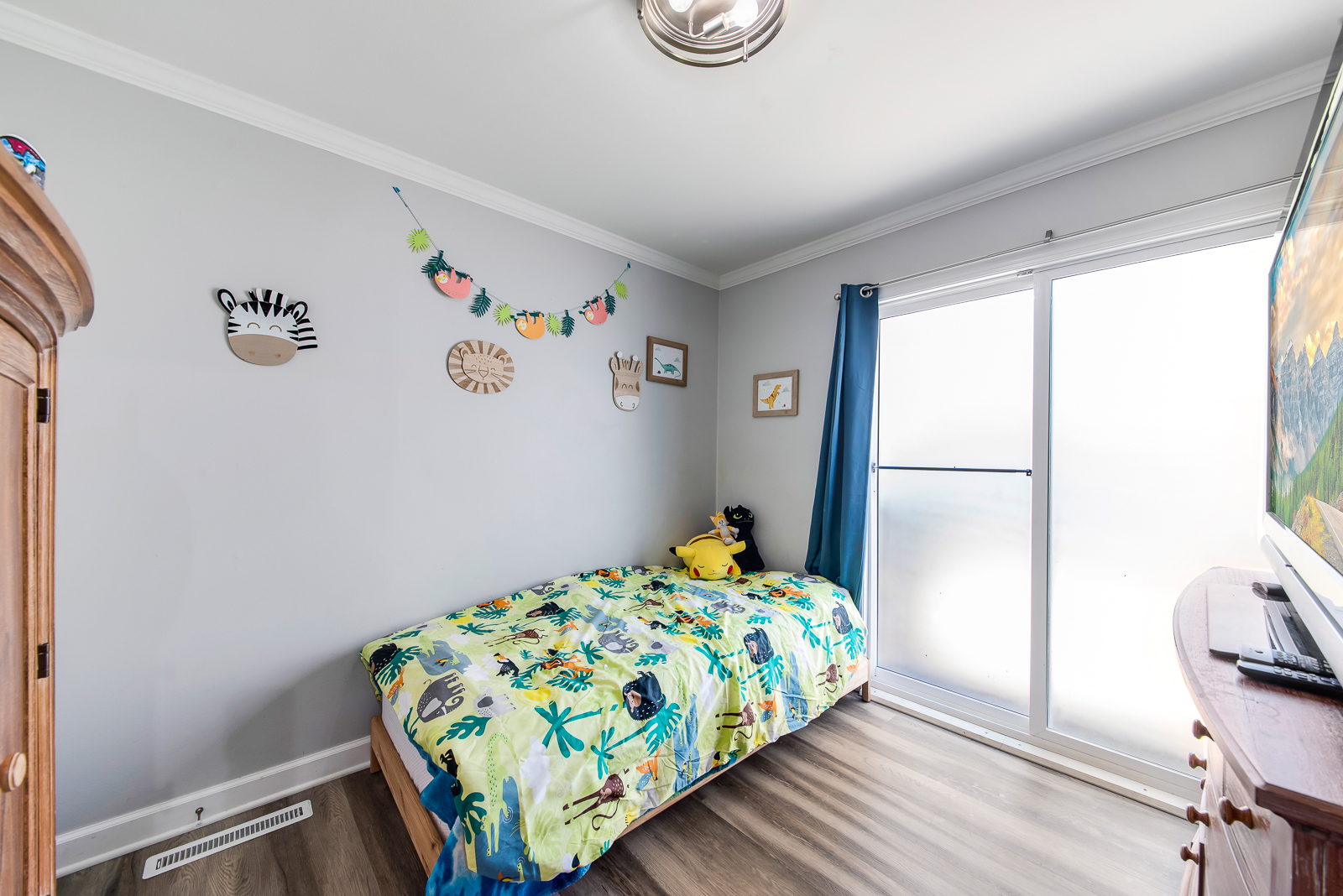 7517 Beloit Avenue Bridgeview, IL 60455 - Photo 12 of 18 a bedroom with a bed and a window