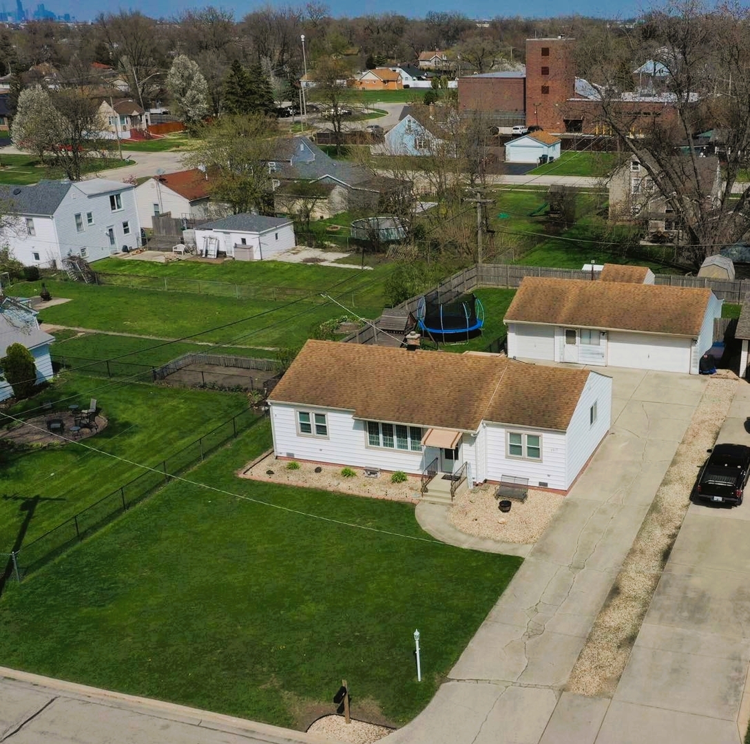 7517 Beloit Avenue Bridgeview, IL 60455 - Photo 18 of 18 an aerial view of a house with garden space and houses