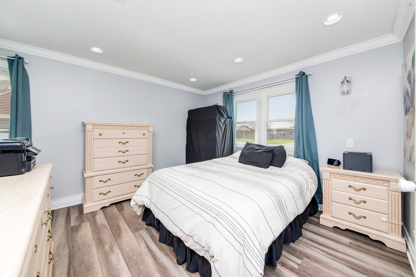 7517 Beloit Avenue Bridgeview, IL 60455 - Photo 7 of 18 a bedroom with a bed and a dresser