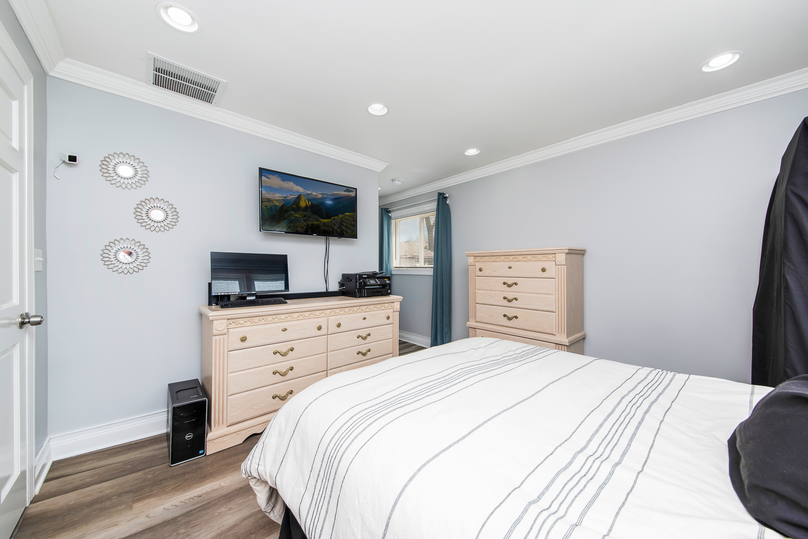 7517 Beloit Avenue Bridgeview, IL 60455 - Photo 8 of 18 a bedroom with a bed and a flat screen tv