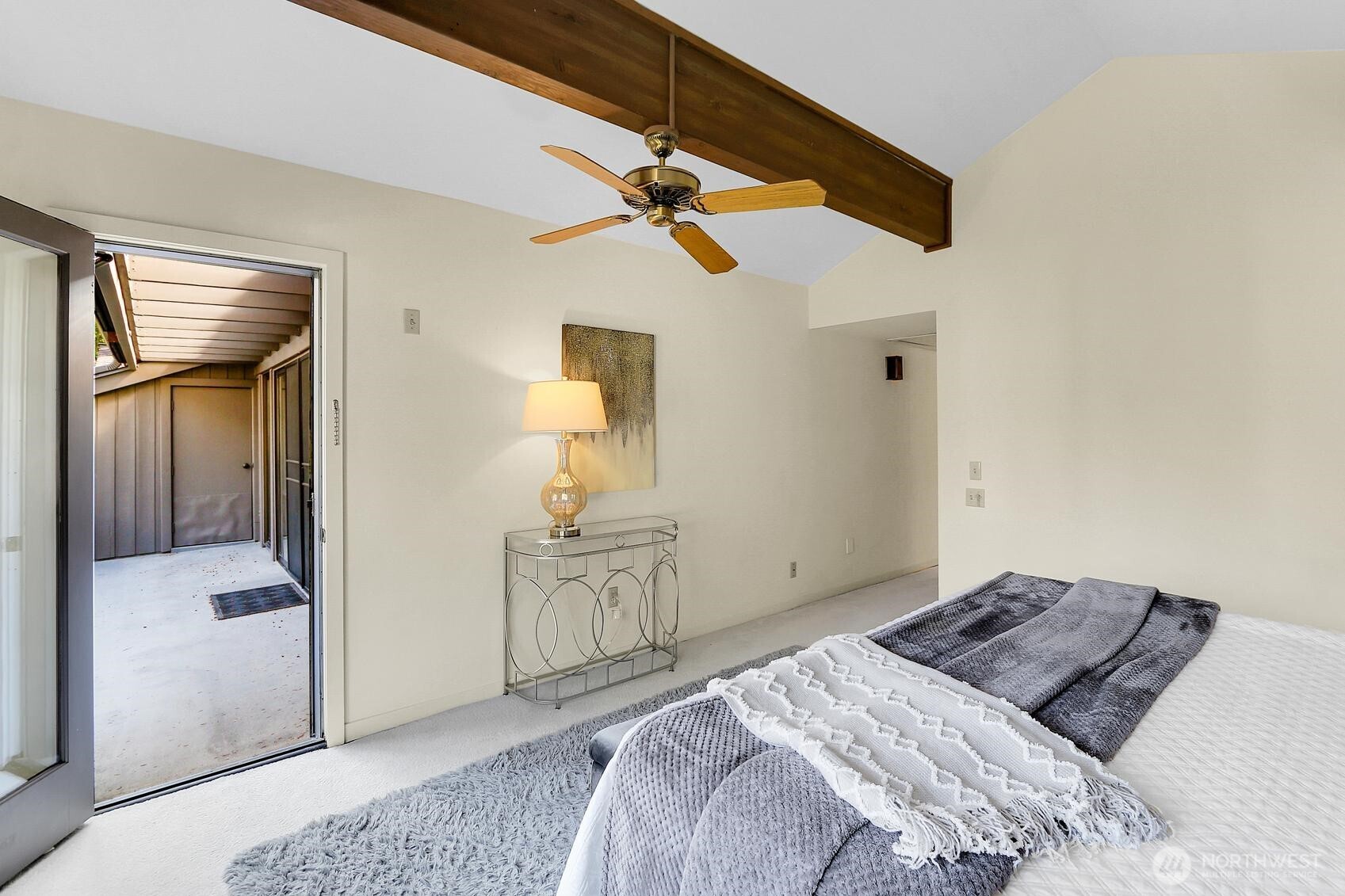 1541 Northeast 143rd Street, Unit H5 Seattle, WA 98125 - Photo 16 of 31 a bedroom with a bed and chandelier