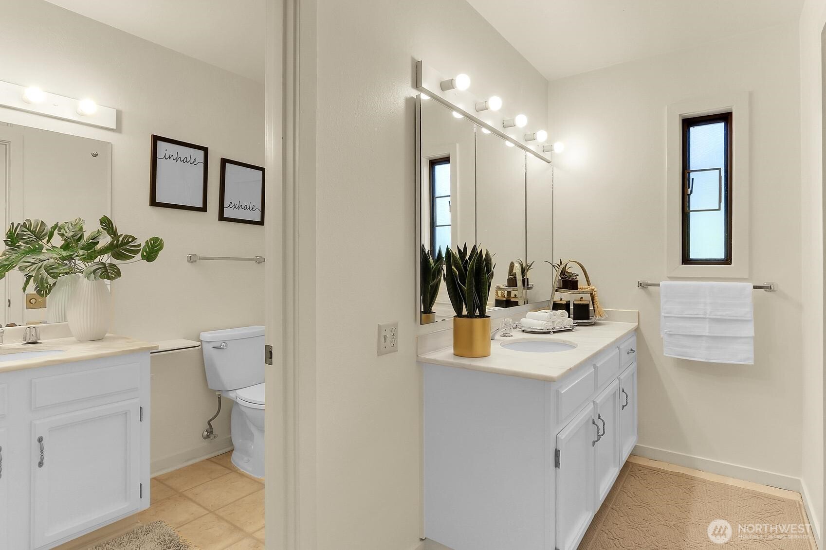 1541 Northeast 143rd Street, Unit H5 Seattle, WA 98125 - Photo 18 of 31 a bathroom with a sink a toilet and mirror