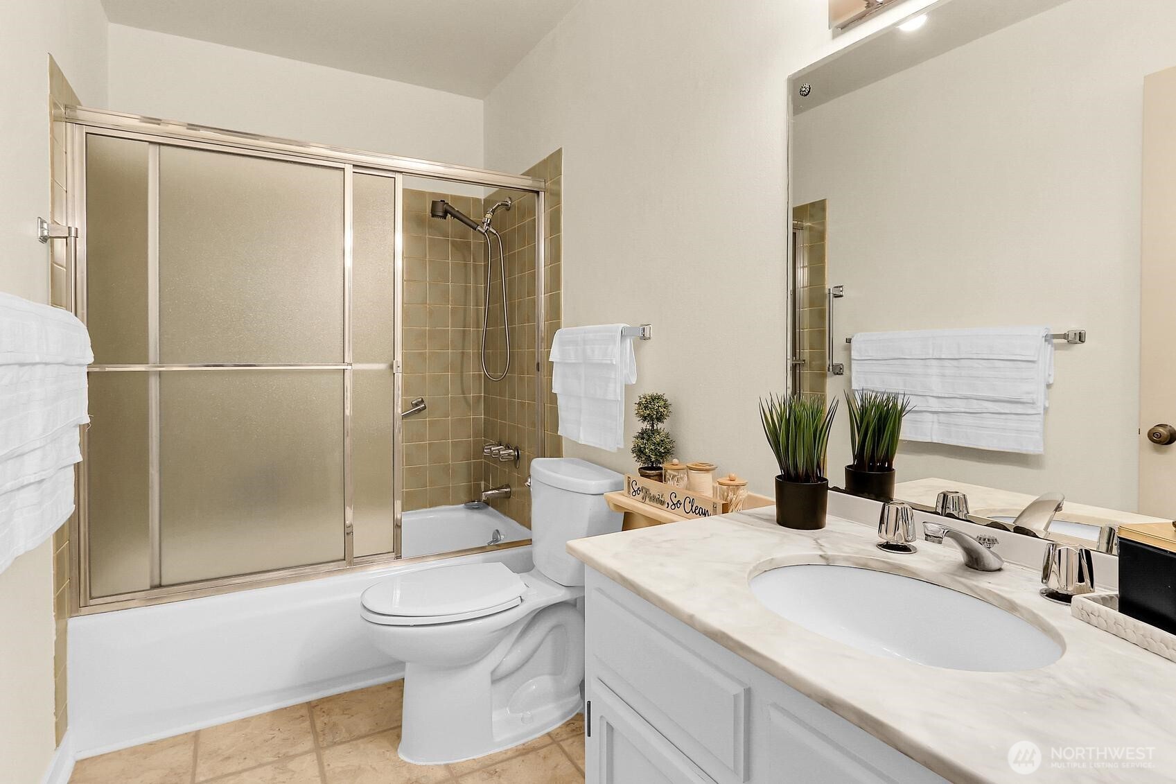 1541 Northeast 143rd Street, Unit H5 Seattle, WA 98125 - Photo 21 of 31 a bathroom with a sink toilet and shower