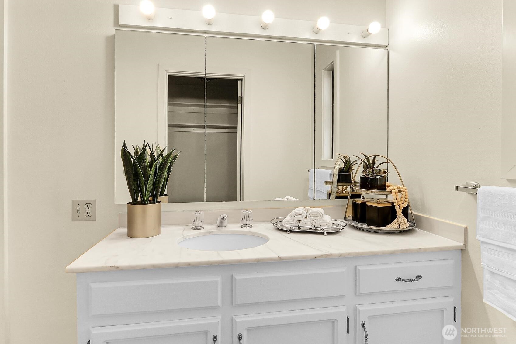 1541 Northeast 143rd Street, Unit H5 Seattle, WA 98125 - Photo 22 of 31 a bathroom with a sink and a mirror