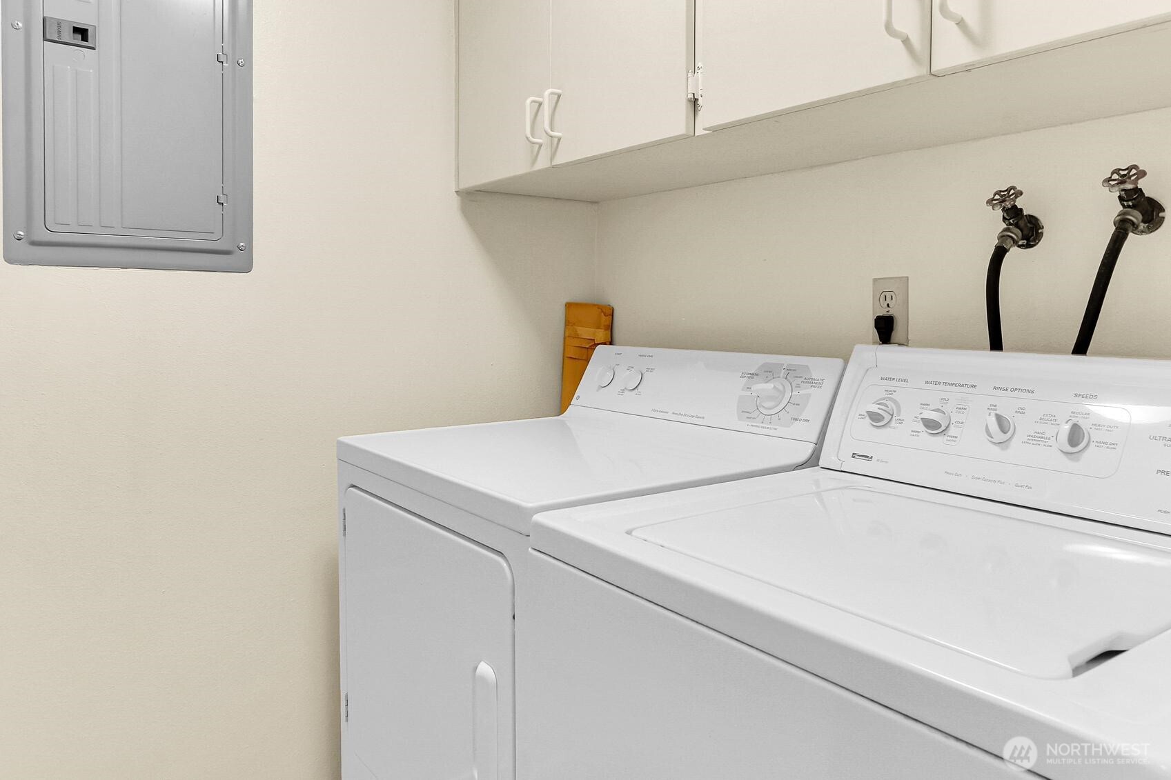 1541 Northeast 143rd Street, Unit H5 Seattle, WA 98125 - Photo 23 of 31 a close up of a washer and dryer