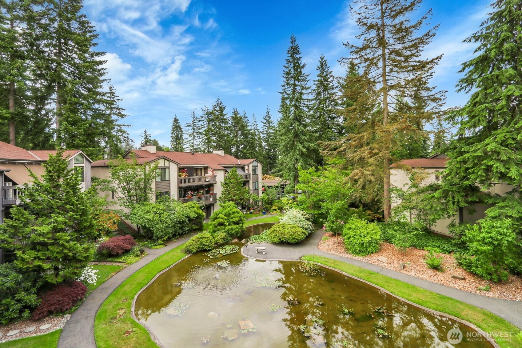 1541 Northeast 143rd Street, Unit H5 Seattle, WA 98125 - Photo 25 of 31 a view of a swimming pool with a yard