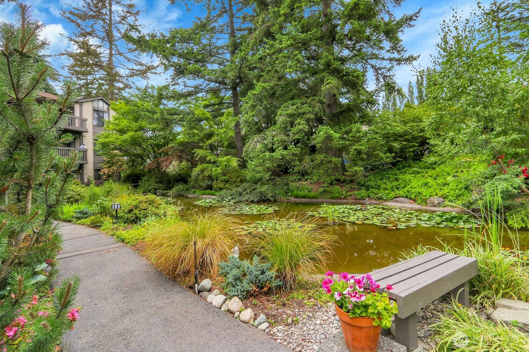 1541 Northeast 143rd Street, Unit H5 Seattle, WA 98125 - Photo 29 of 31 a view of lake with seating space