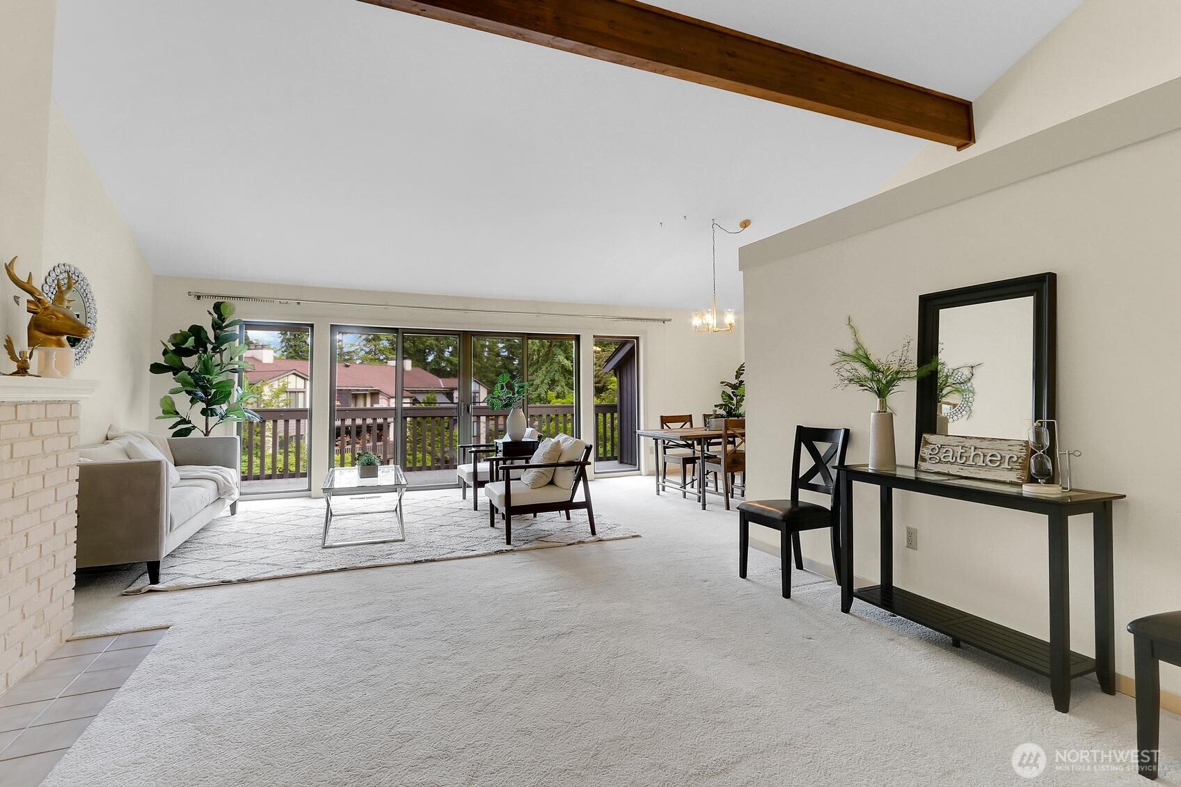 1541 Northeast 143rd Street, Unit H5 Seattle, WA 98125 - Photo 3 of 31 a view of a livingroom with furniture and hardwood floor