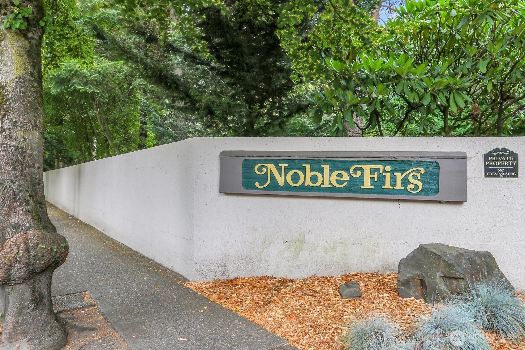 1541 Northeast 143rd Street, Unit H5 Seattle, WA 98125 - Photo 31 of 31 a view of a sign board