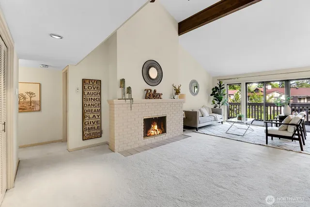 a view of a livingroom with furniture and a fireplace