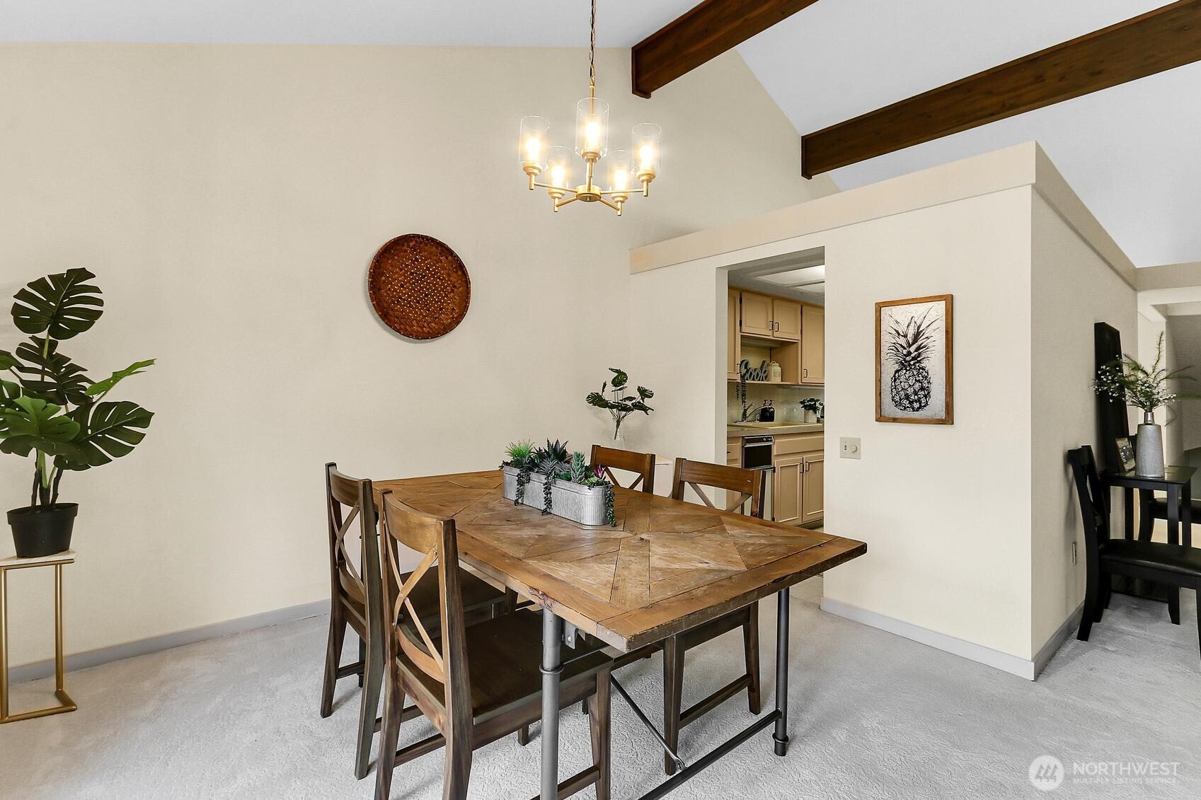 1541 Northeast 143rd Street, Unit H5 Seattle, WA 98125 - Photo 10 of 31 a view of a dining room with furniture and chandelier