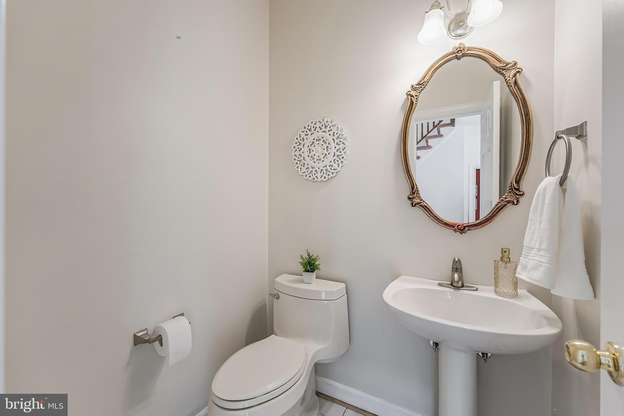 5501 Ashleigh Road Fairfax, VA 22030 - Photo 37 of 77 a bathroom with a toilet sink and mirror