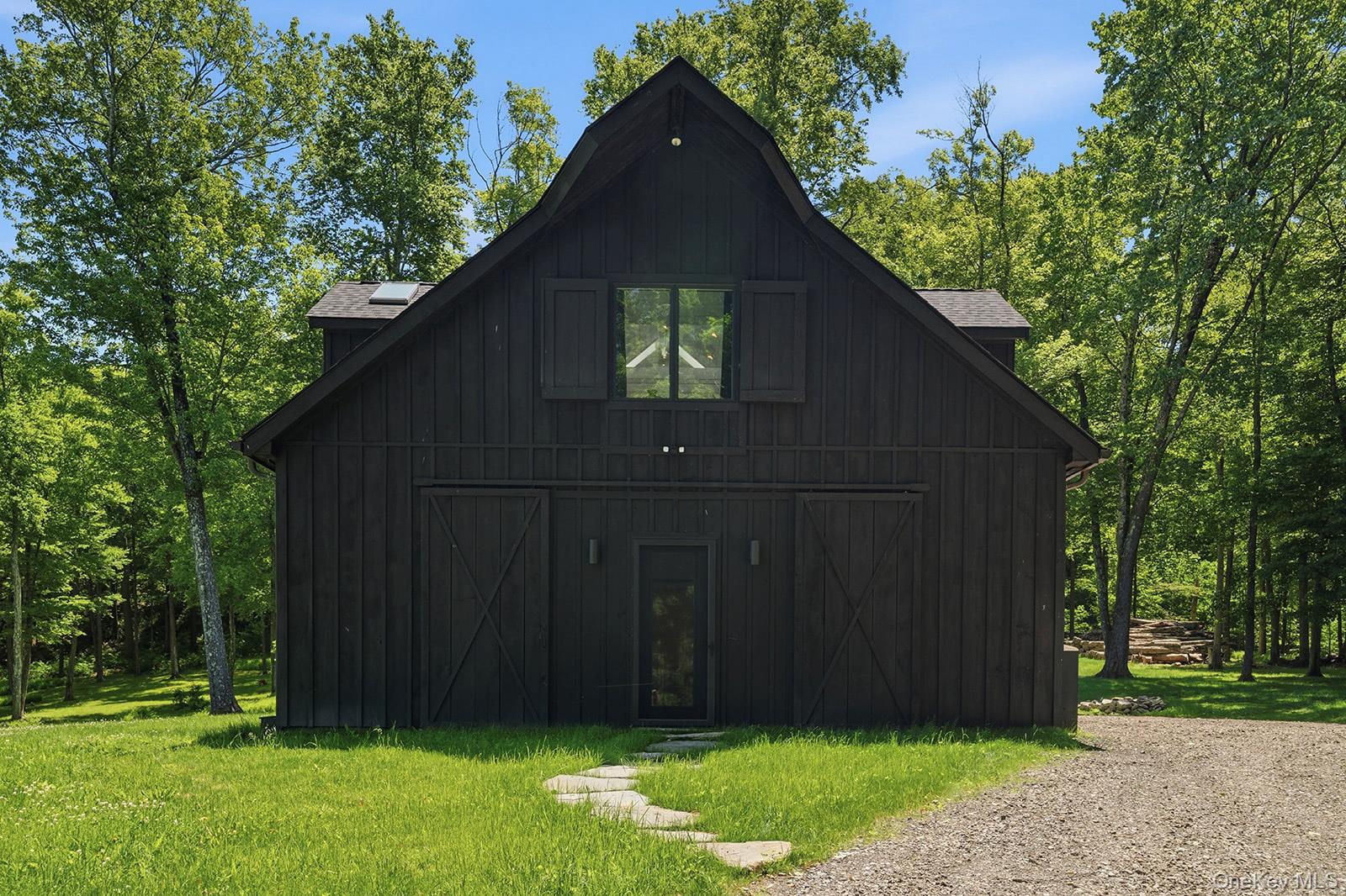 180 Dean Road Carmel, NY 10512 - Photo 27 of 50 Barn houses a gym, a full kitchen and a private guest suite, a studio/recreation room, and farmequipment storage and workshop.