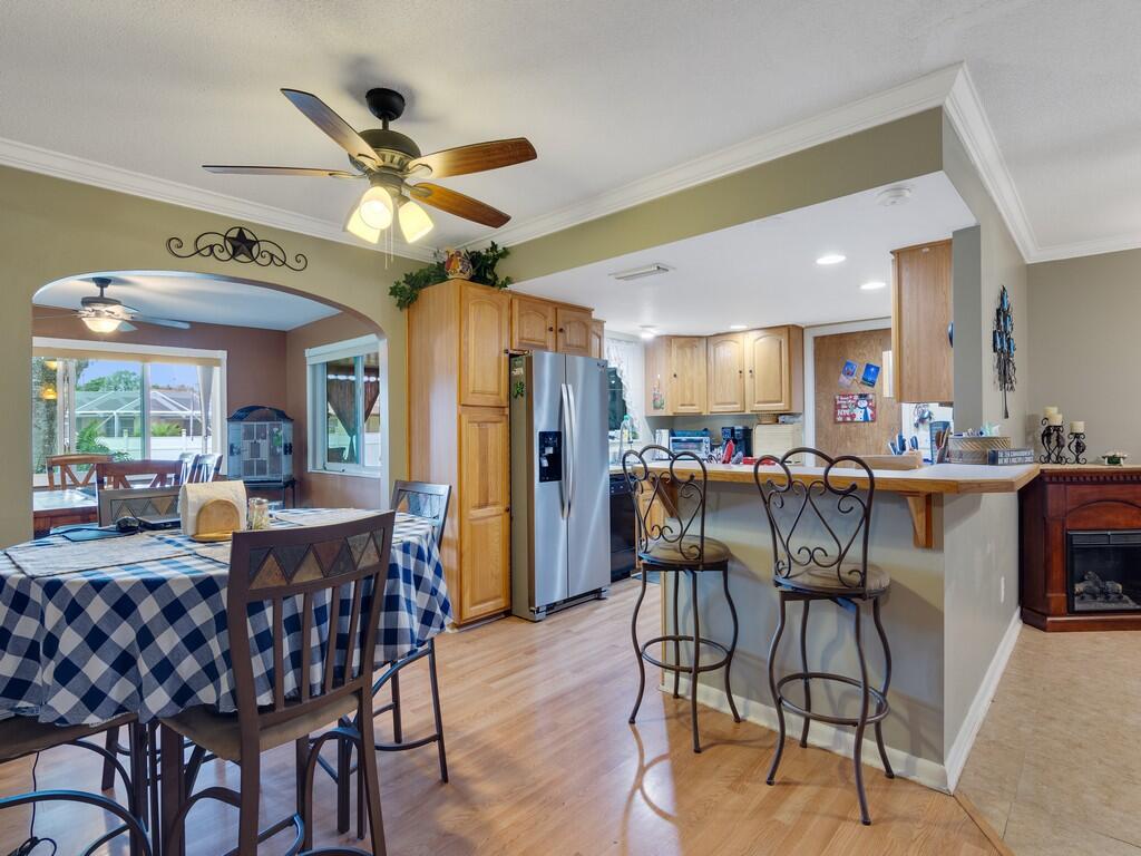 3118 Old Edwards Road Fort Pierce, FL 34981 - Photo 13 of 35 a view of a dining room with furniture window and wooden floor
