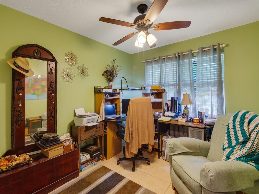 3118 Old Edwards Road Fort Pierce, FL 34981 - Photo 20 of 35 a view of a workspace with furniture and a window