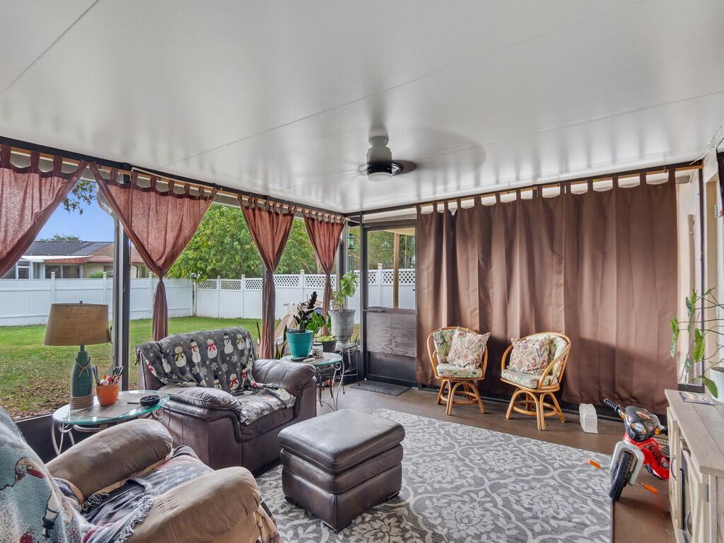 3118 Old Edwards Road Fort Pierce, FL 34981 - Photo 21 of 35 a living room with furniture and a large window
