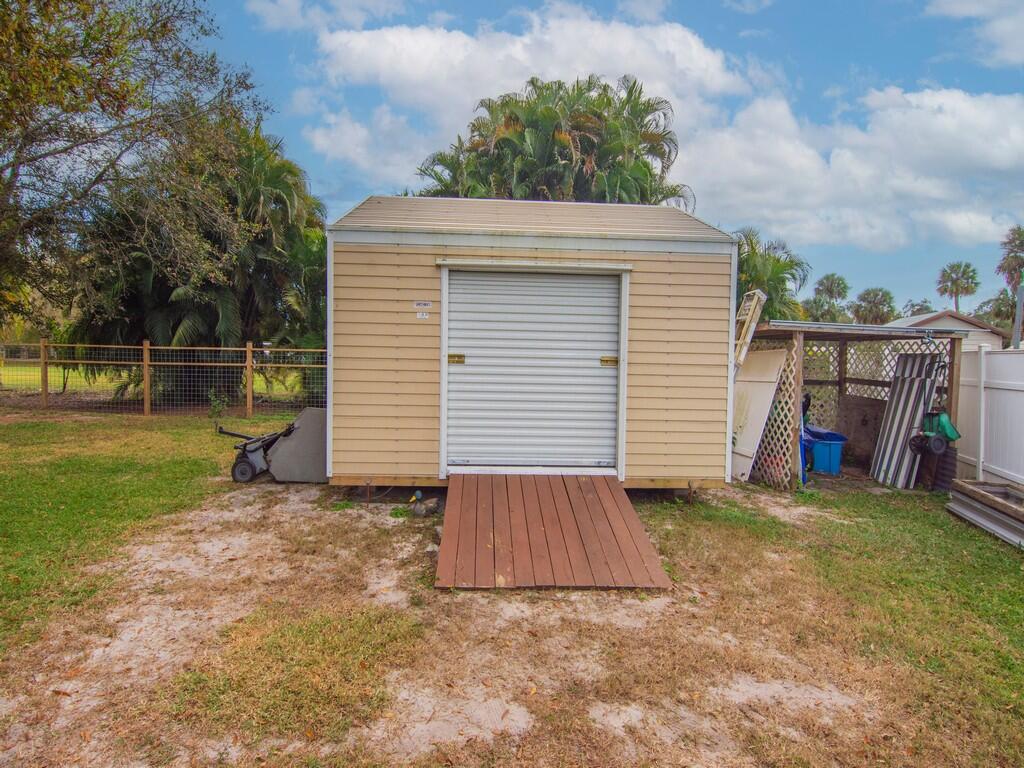 3118 Old Edwards Road Fort Pierce, FL 34981 - Photo 27 of 35 a view of backyard with cabin
