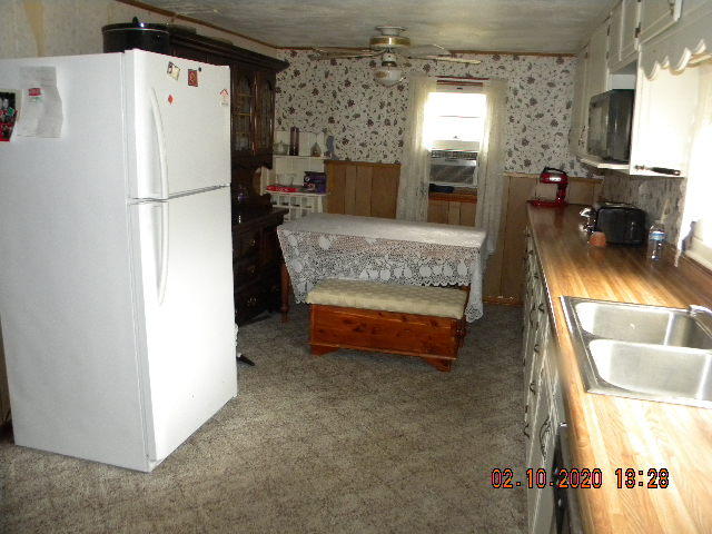 2940 North Fork Road Elliston, VA 24087 - Photo 8 of 18 a kitchen with refrigerator and window