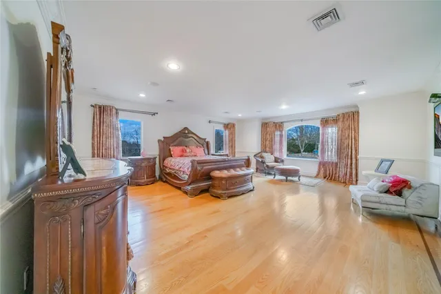 a living room with furniture kitchen view and a refrigerator