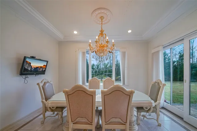a view of a dining room with furniture window and outside view