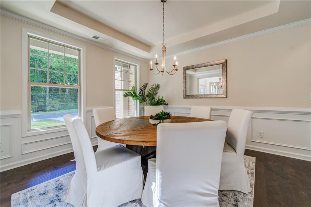 3430 South Scales Road Duluth, GA 30097 - Photo 12 of 77 a view of a dining room with furniture window and wooden floor