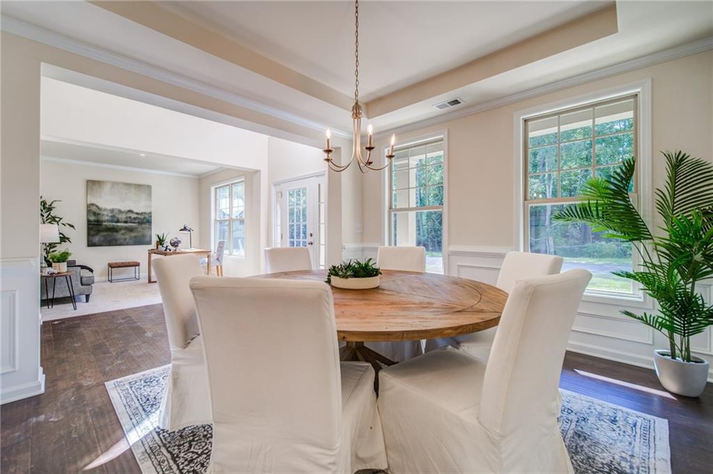 3430 South Scales Road Duluth, GA 30097 - Photo 13 of 77 a view of a dining room with furniture window and wooden floor