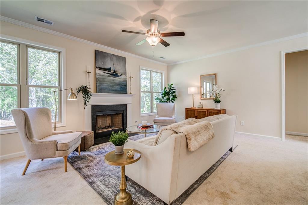 3430 South Scales Road Duluth, GA 30097 - Photo 14 of 77 a living room with furniture fireplace and window
