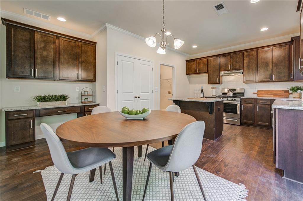 3430 South Scales Road Duluth, GA 30097 - Photo 23 of 77 a view of a dining room with furniture