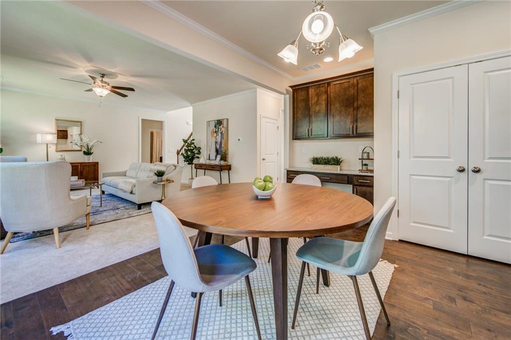 3430 South Scales Road Duluth, GA 30097 - Photo 24 of 77 a view of a a dining room with furniture window and wooden floor