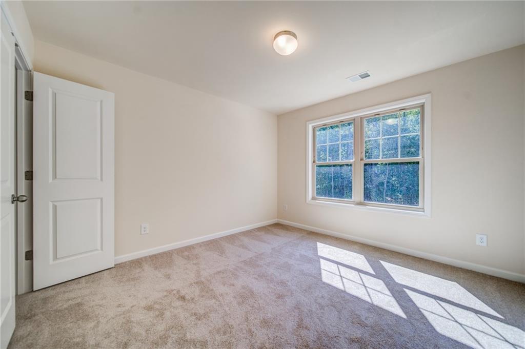 3430 South Scales Road Duluth, GA 30097 - Photo 38 of 77 an empty room with windows