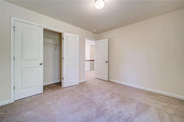 a view of a room with wooden walls