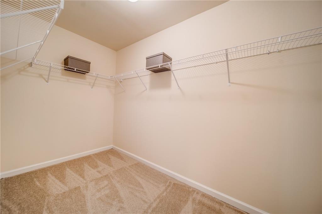 3430 South Scales Road Duluth, GA 30097 - Photo 62 of 77 a view of a room with racks on the wall