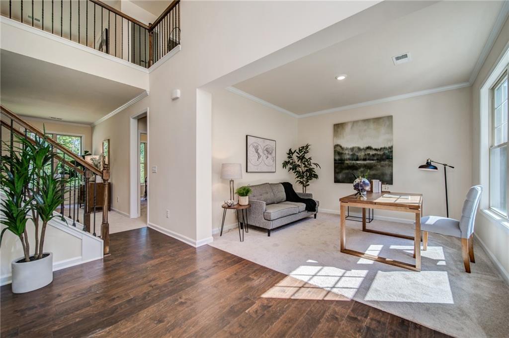 3430 South Scales Road Duluth, GA 30097 - Photo 7 of 77 a living room with furniture and a wooden floor