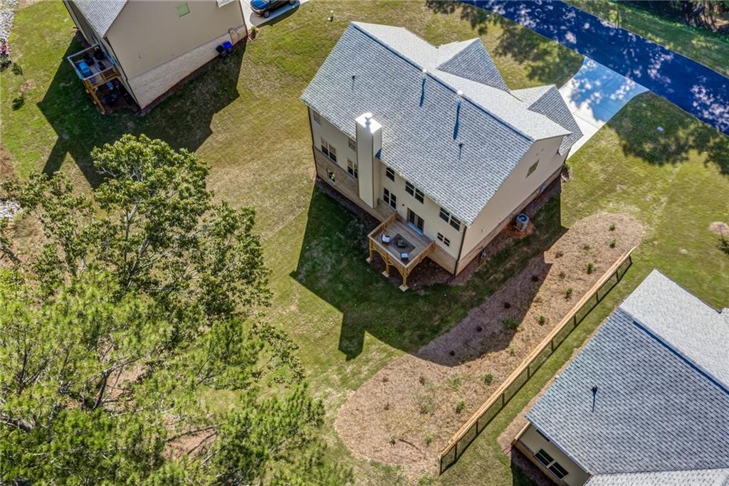 3430 South Scales Road Duluth, GA 30097 - Photo 73 of 77 an aerial view of a house with a yard and large trees