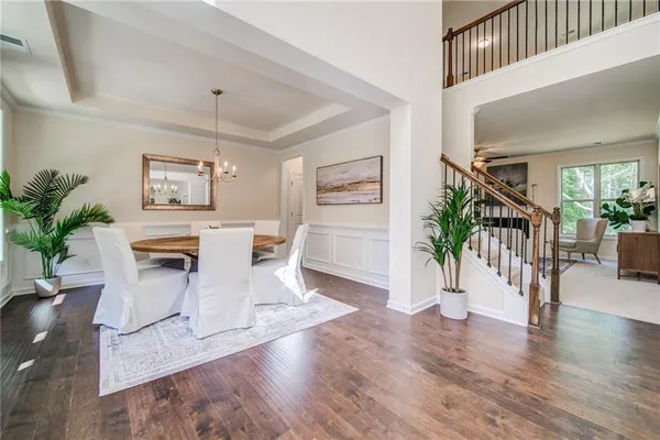 a view of a dining room with furniture window and wooden floor