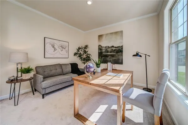 a view of a dining room with furniture window and wooden floor