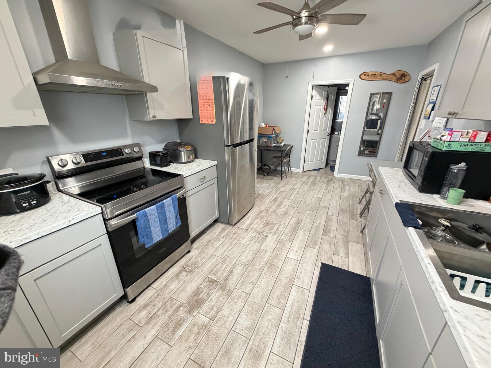 823 West Main Street Waynesboro, PA 17268 - Photo 5 of 24 a kitchen with stainless steel appliances a stove a sink and a refrigerator