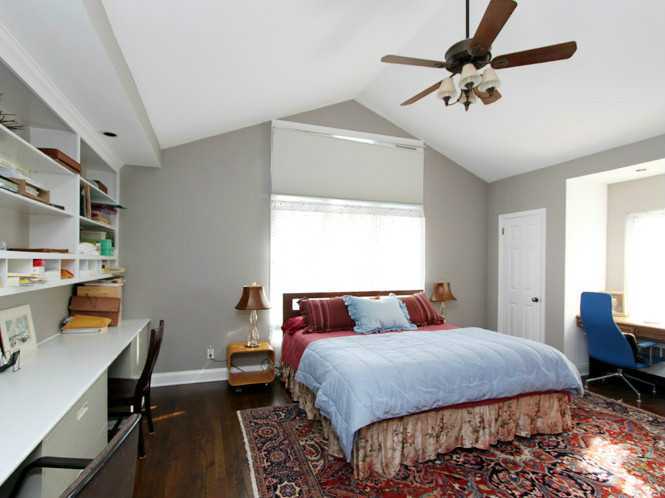 25 Nearwater Lane Riverside, CT 06878 - Photo 8 of 13 a bedroom with a bed and a chandelier