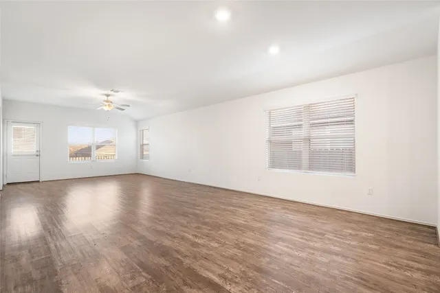 a view of an empty room with a window