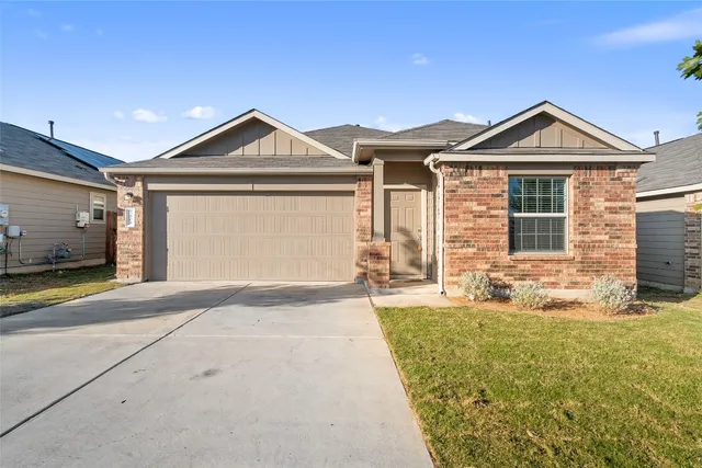 a front view of a house with yard