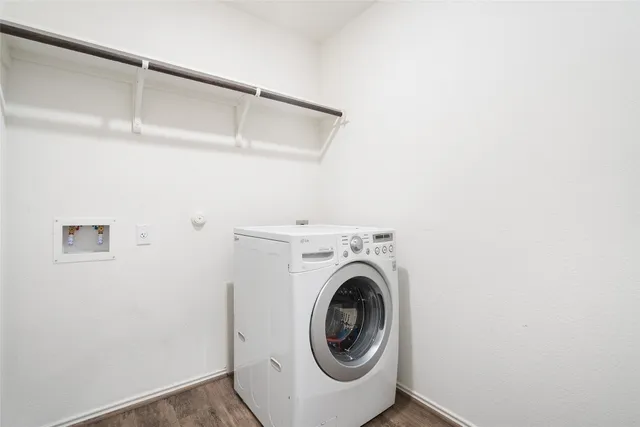a bathroom with a tub sink shower and mirror